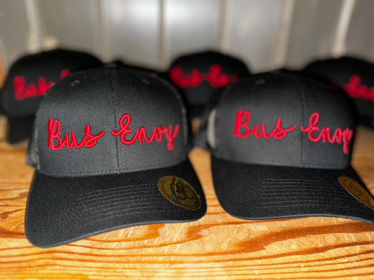 Snap Back Trucker Cap. All Black. Red 3D logo