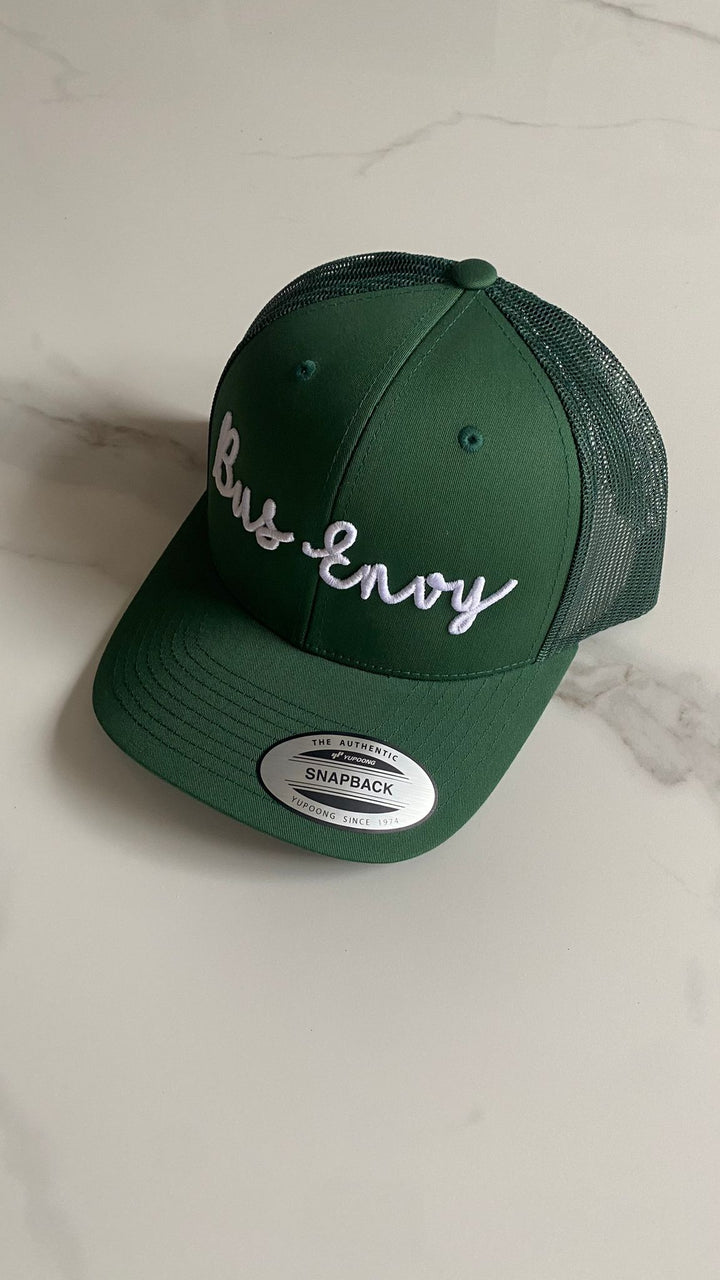 Snap Back Trucker Cap. Green. White 3D logo