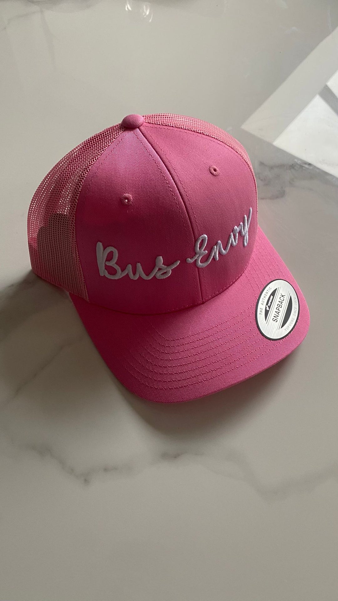 Snap Back Trucker Cap. Pink. White 3D logo