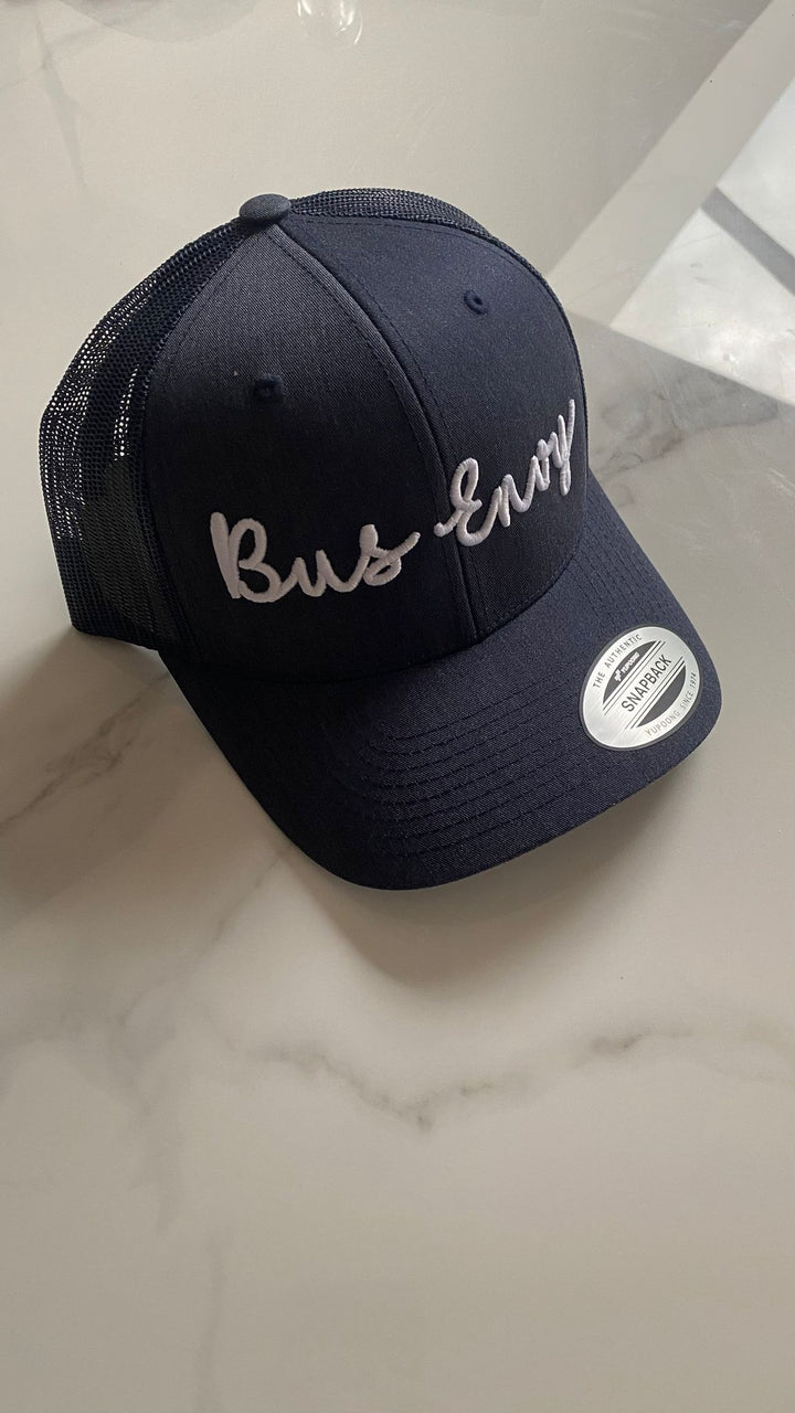 Snap Back Trucker Cap. Navy. White 3D logo