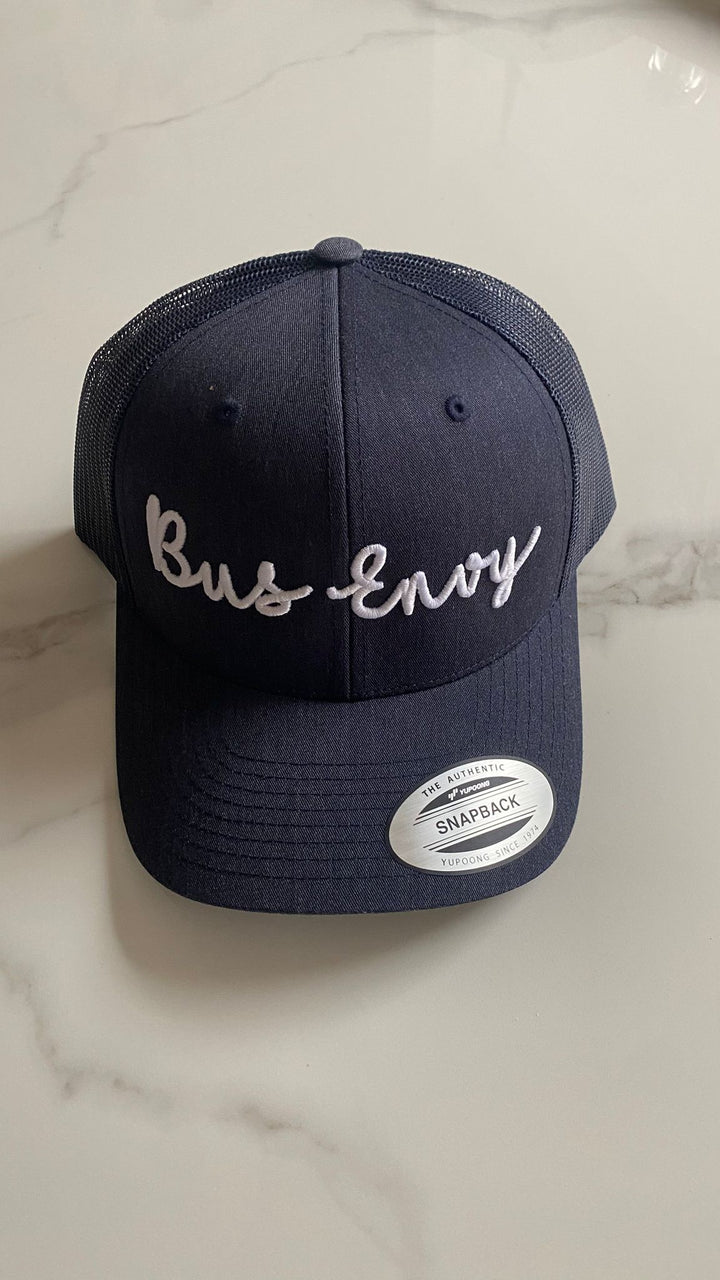 Snap Back Trucker Cap. Navy. White 3D logo