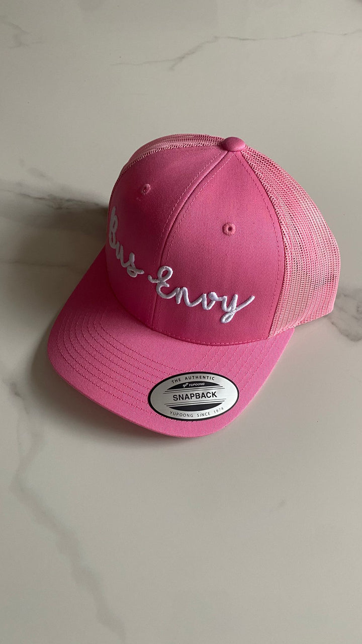 Snap Back Trucker Cap. Pink. White 3D logo