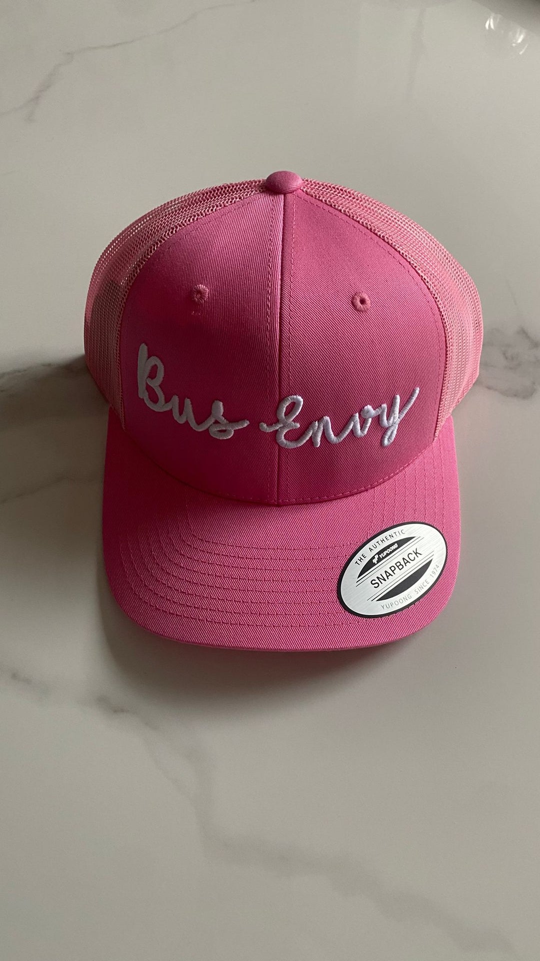 Snap Back Trucker Cap. Pink. White 3D logo