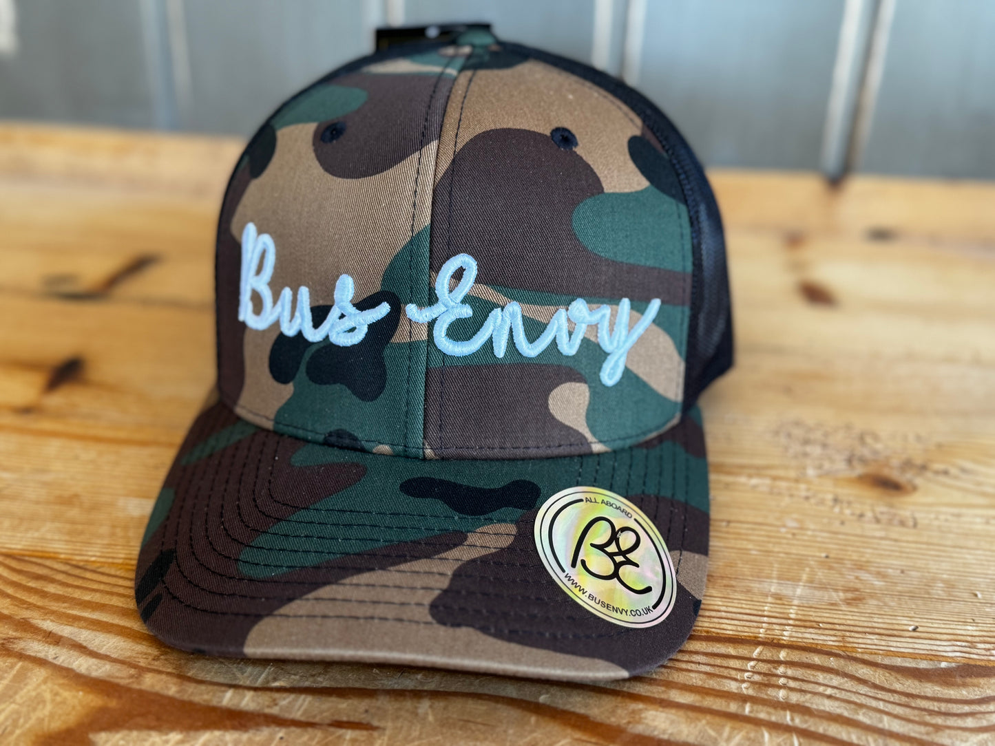 Snap Back Trucker Cap. Cammo & Black. White 3D logo