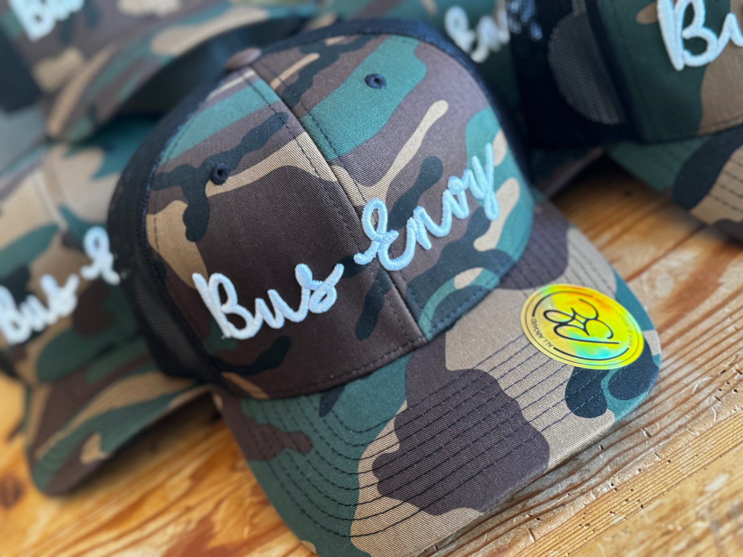 Snap Back Trucker Cap. Cammo & Black. White 3D logo