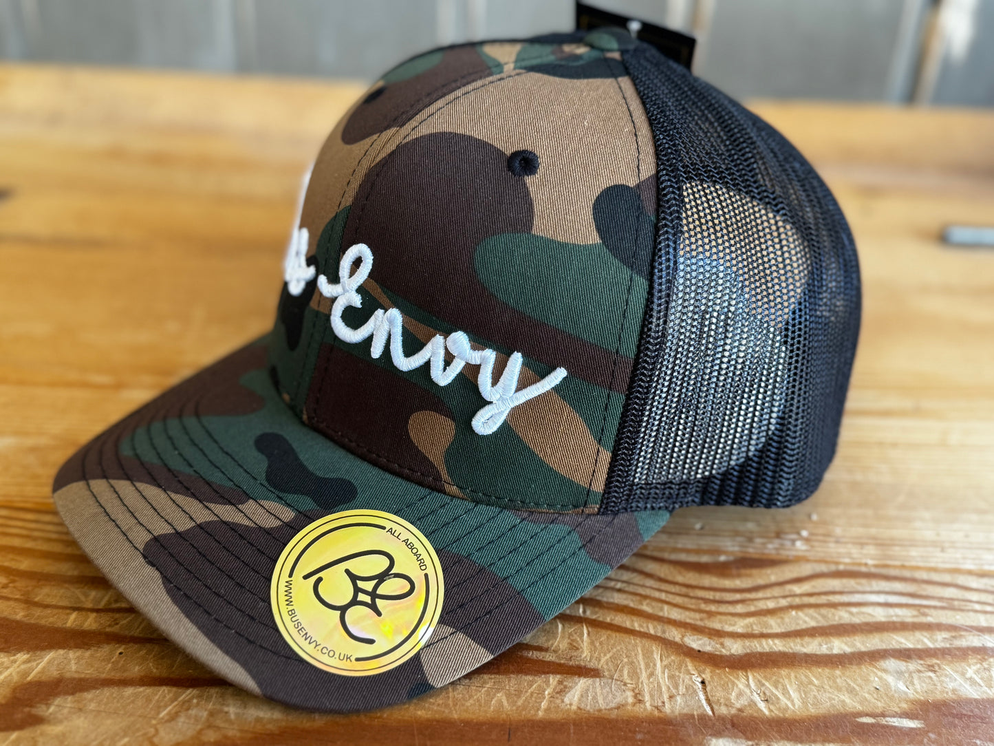 Snap Back Trucker Cap. Cammo & Black. White 3D logo