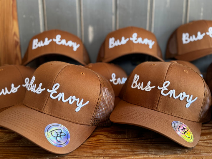 Snap Back Trucker Cap. Camel & white 3D logo