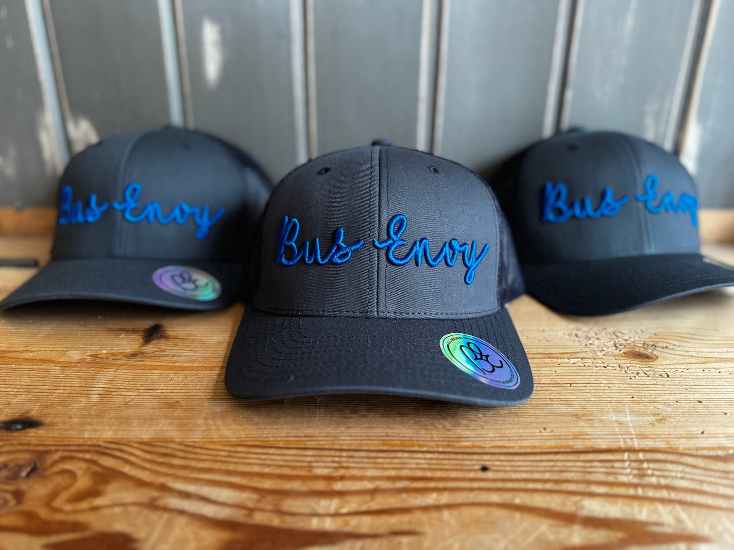 Snap back Trucker Cap. Grey & blue 3D logo