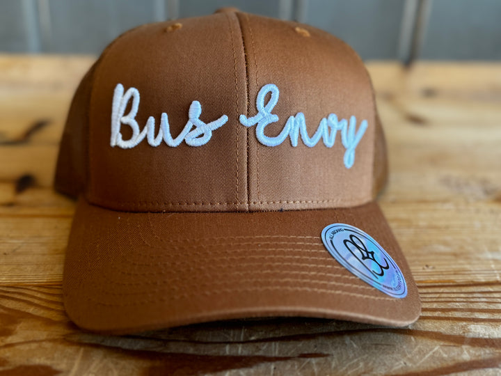 Snap Back Trucker Cap. Camel & white 3D logo