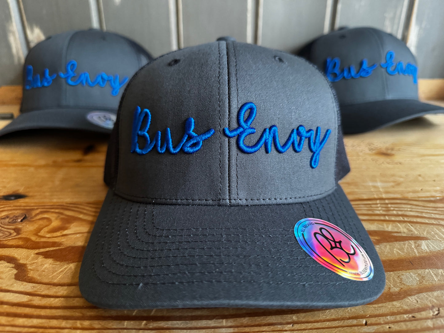 Snap back Trucker Cap. Grey & blue 3D logo