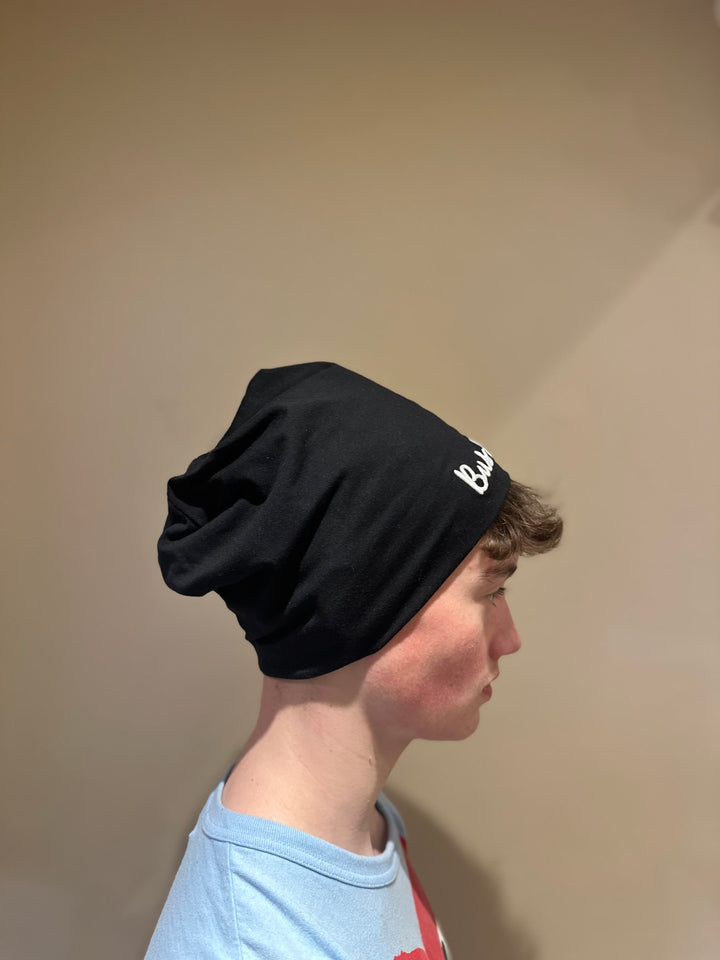 Unisex slouchy Bus Envy beanie. Black & white