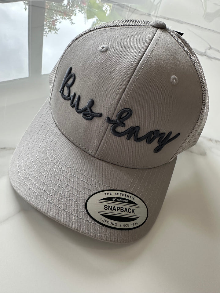 Snap Back Trucker Cap. Grey & grey. Dark grey 3D logo