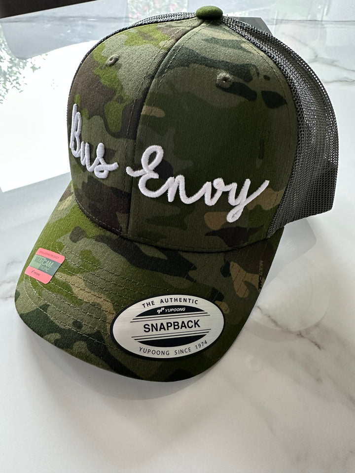 Snap Back Trucker Cap. Cammo & Green. White 3D logo
