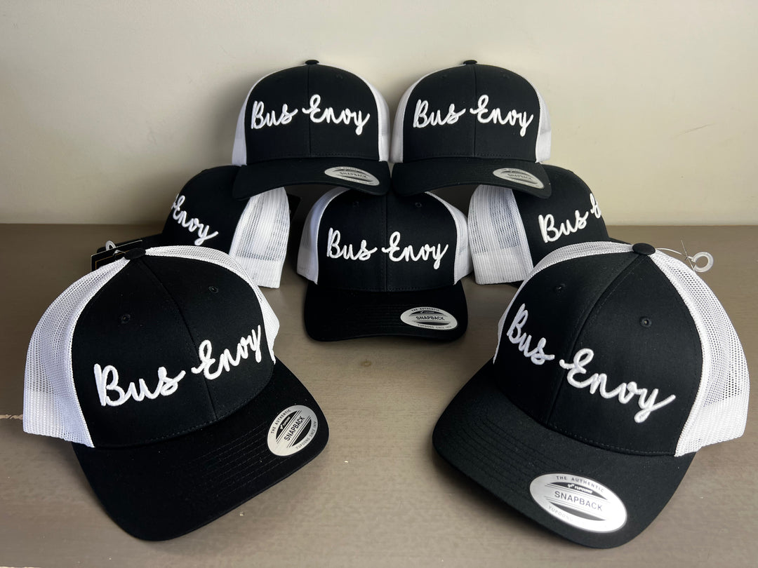 Snap Back Trucker Cap. Black & White. White 3D logo