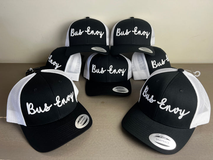 Snap Back Trucker Cap. Black & White. White 3D logo