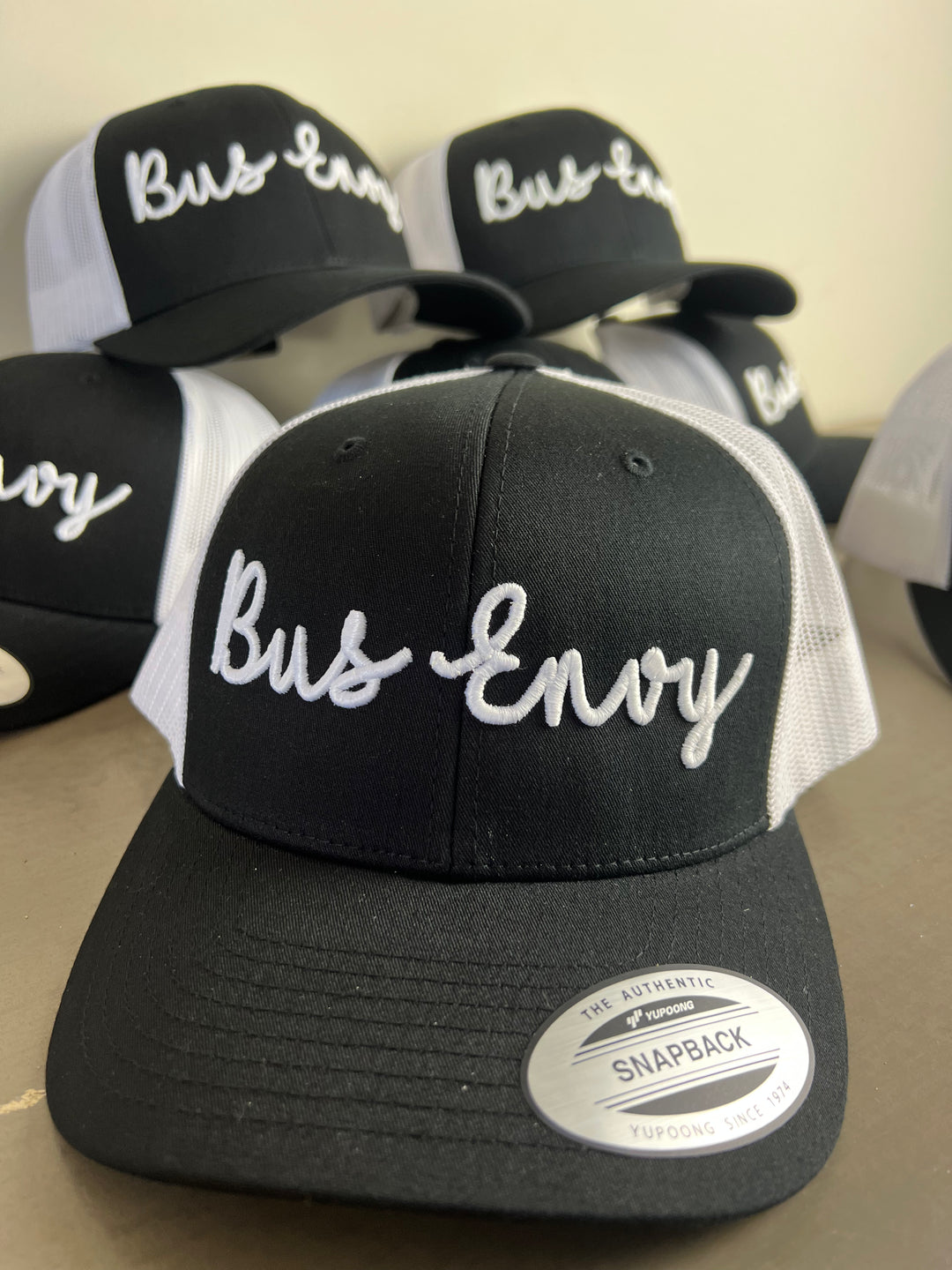 Snap Back Trucker Cap. Black & White. White 3D logo