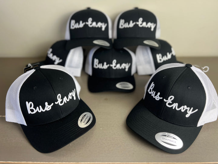 Snap Back Trucker Cap. Black & White. White 3D logo