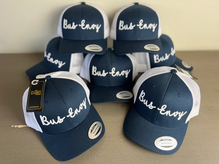 Snap Back Trucker Cap. Navy & white. White 3D logo