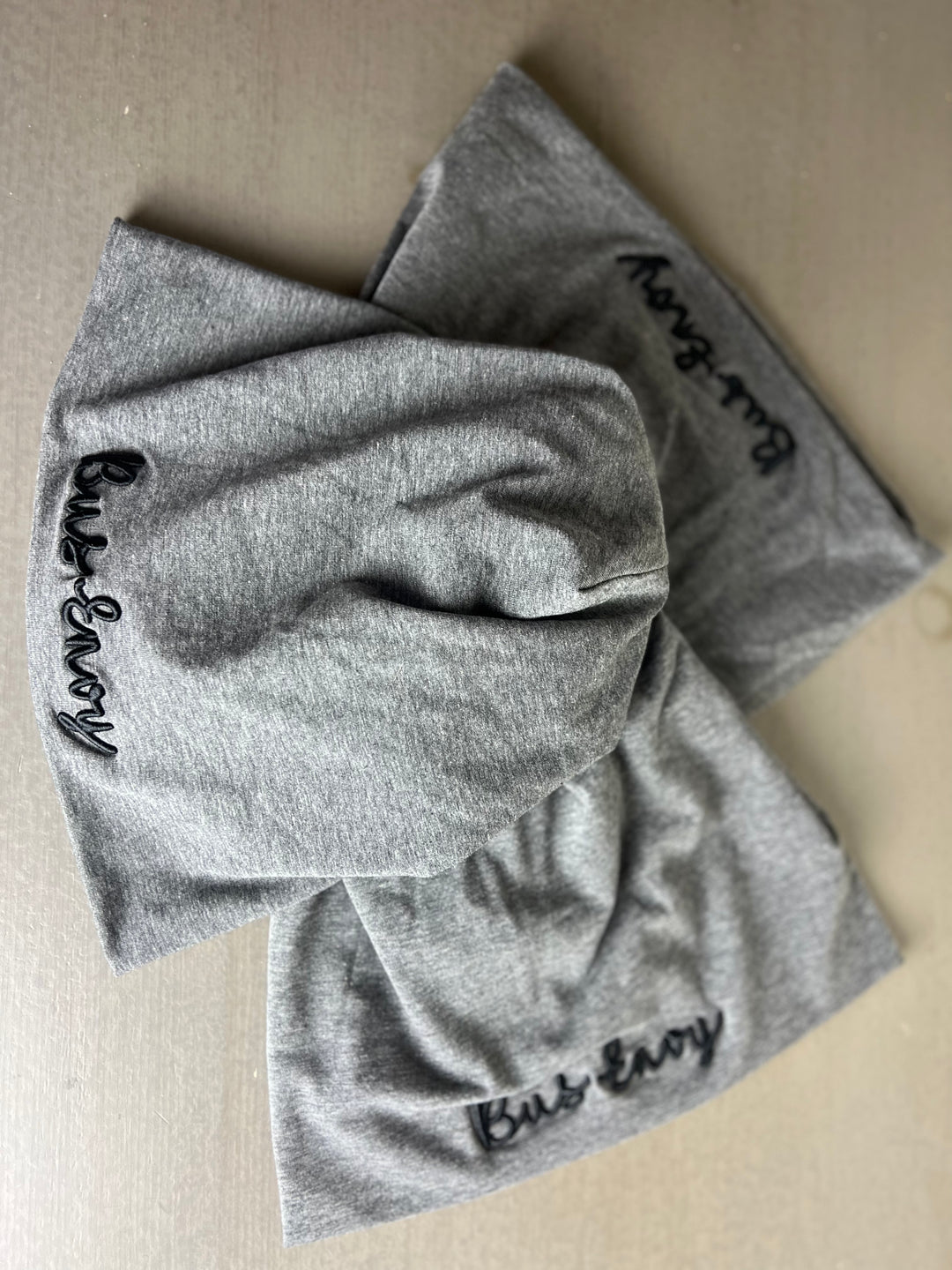 Unisex slouchy Bus Envy beanie. Charcoal grey & black