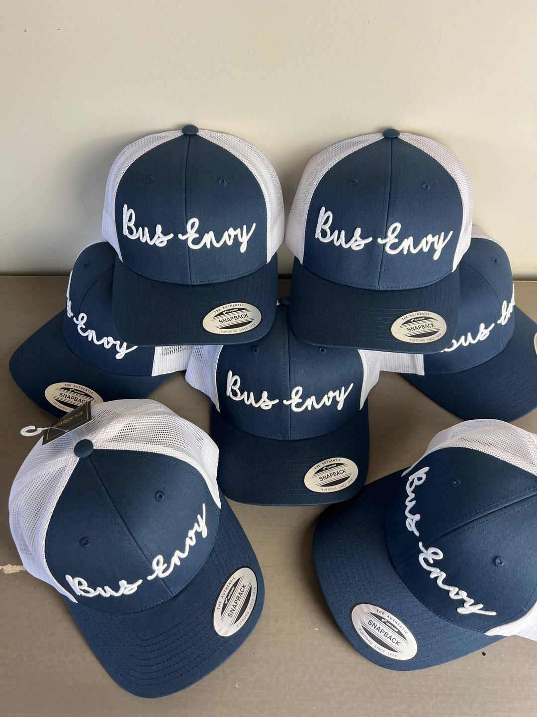 Snap Back Trucker Cap. Navy & white. White 3D logo